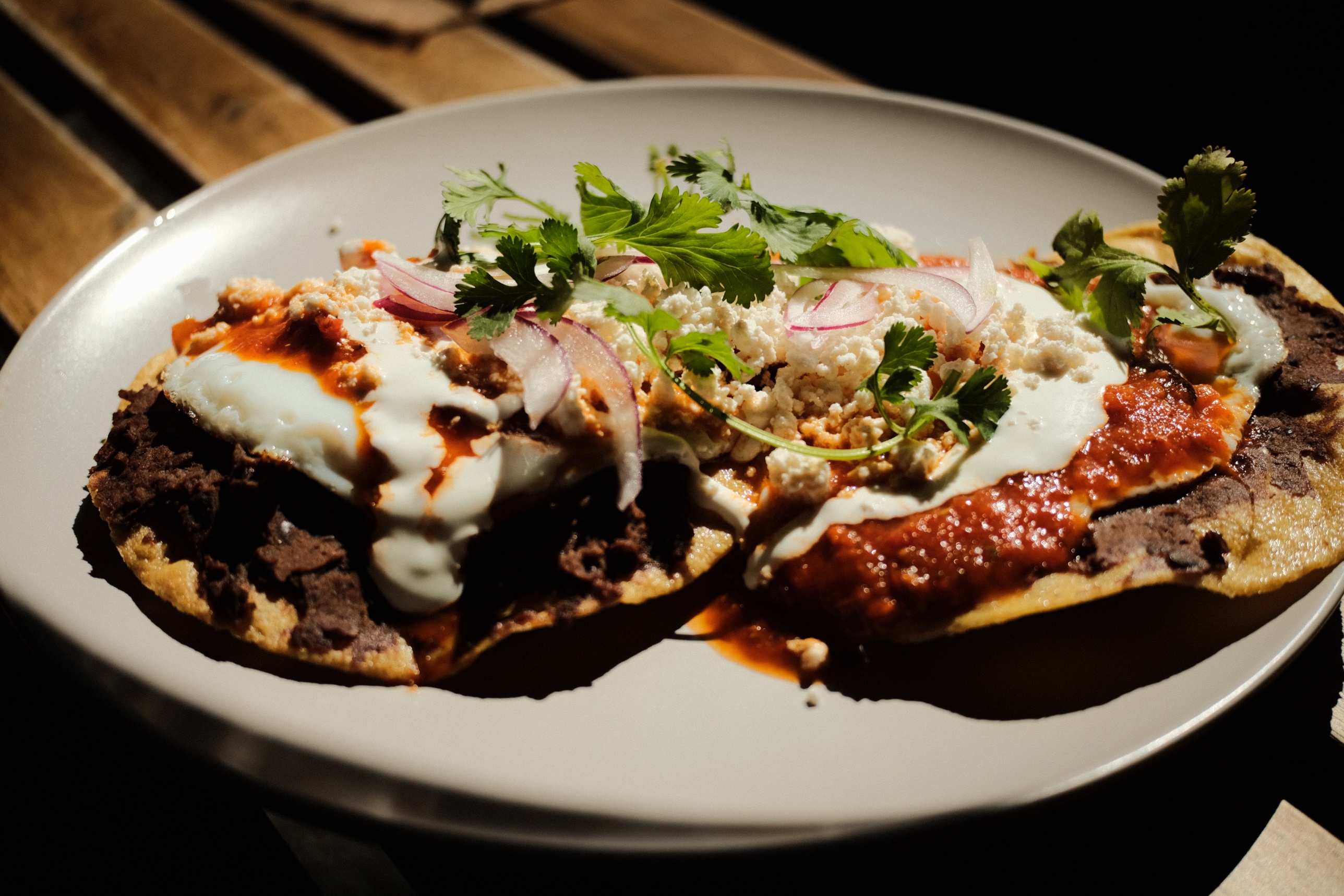 Chilaquiles with fried egg, crema, and cotija
