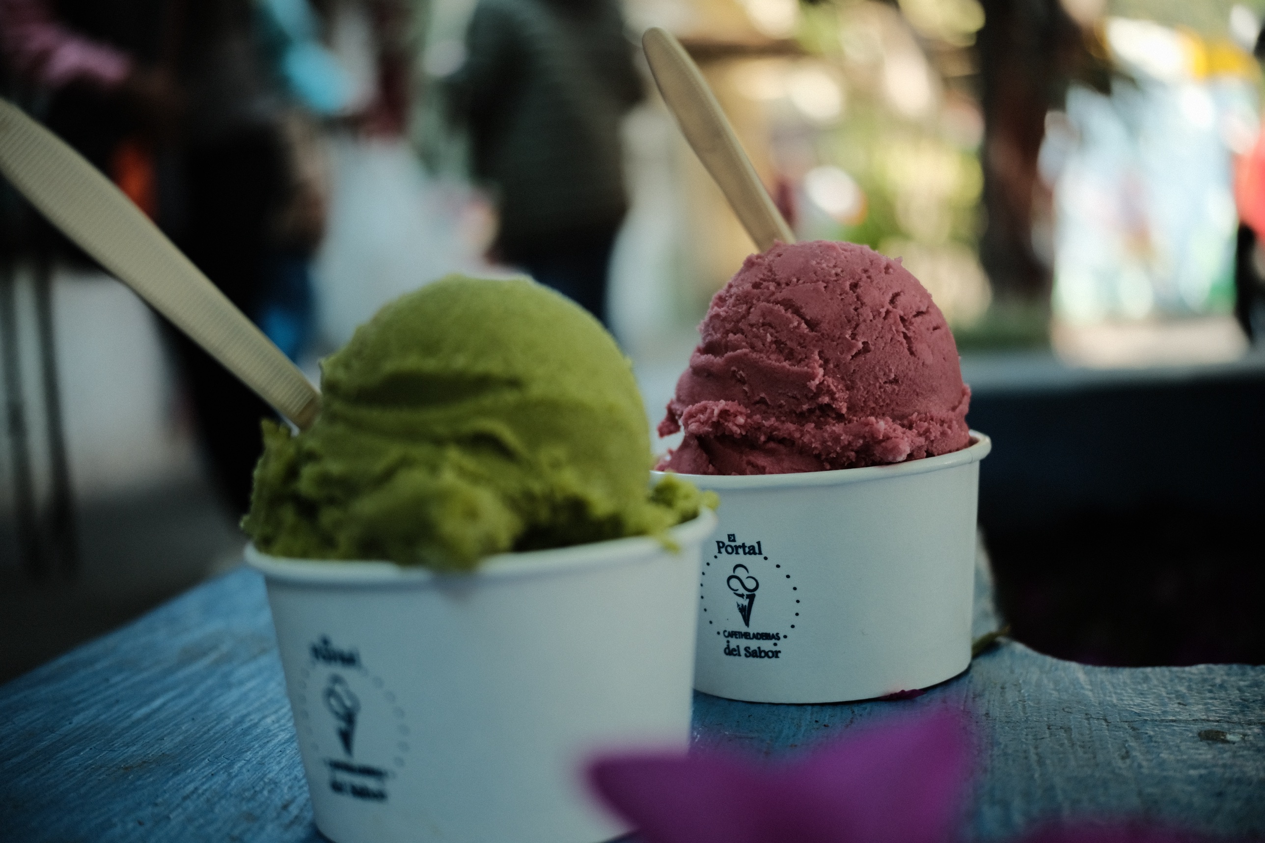 Two scoops of sorbet in paper cups